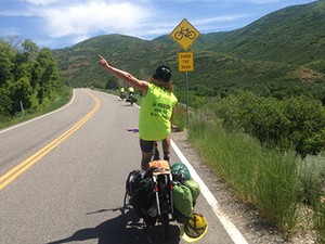 a member of the Utah Conservation Corp bike crew biking